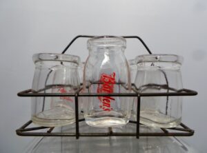 Six Restaurant Glass Creamer Bottles with Wire Carrier