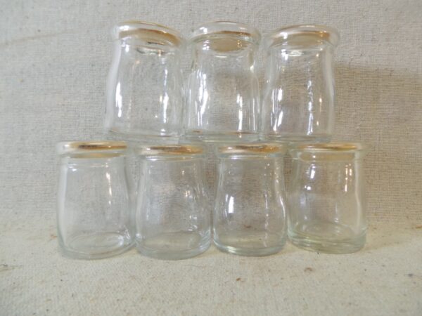 Seven Dairy Creamer Glass Bottles with Paper Lids