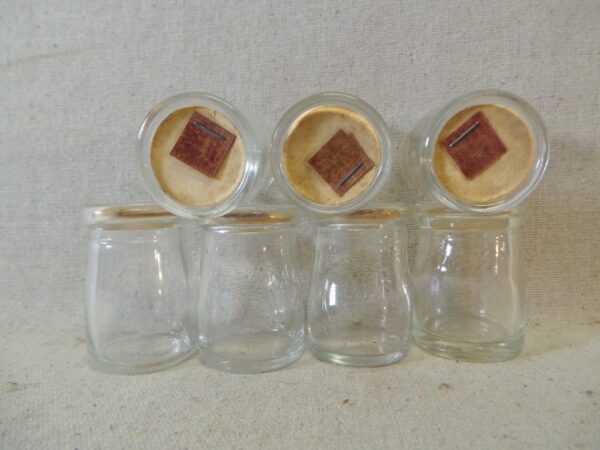 Seven Dairy Creamer Glass Bottles with Paper Lids - Image 2