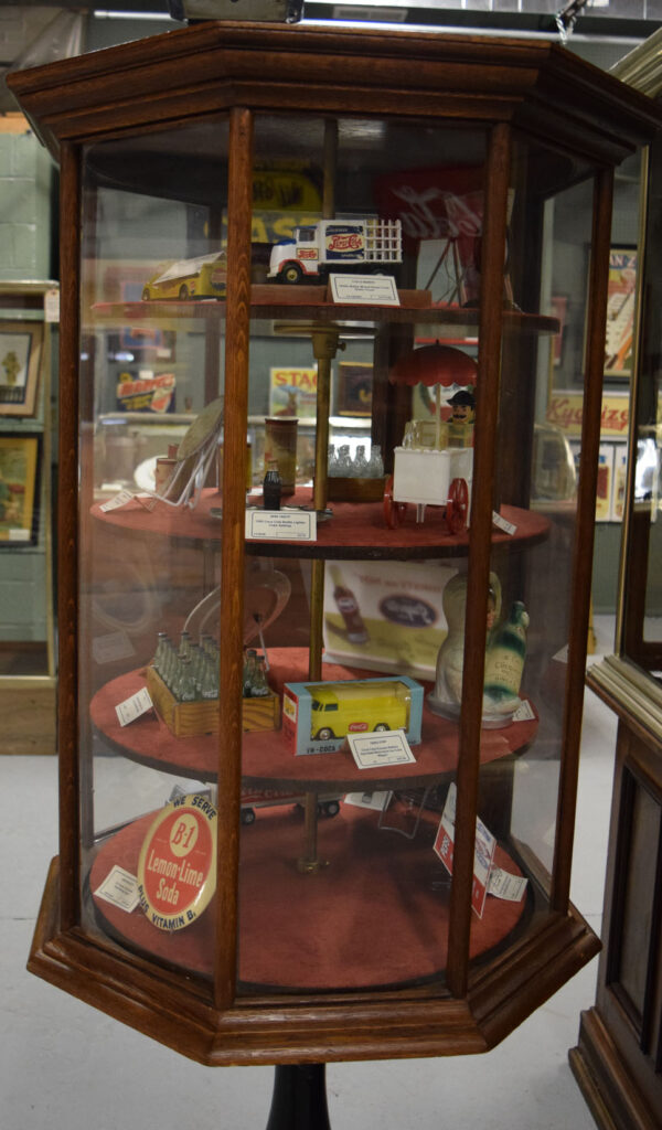 Revolving Octagon Oak Showcase On Ornate Cast Iron Base - Image 8