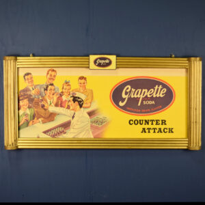 Grapette Soda "Counter Attack" Cardboard Sign & Wooden Frame